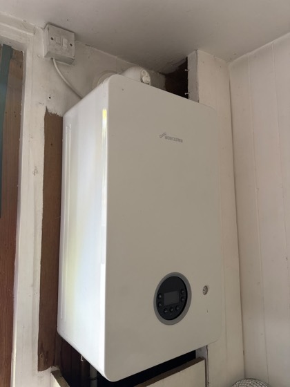 A new Worcester boiler fitted in a cupboard